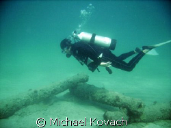 Inspecting the canon on the scuba trail on the inside ree... by Michael Kovach 